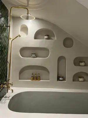 a bathroom with a bath tub and a sink at Private Riad in Marrakech Medina in Marrakech