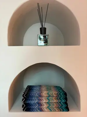 a room with a circular niche with a vase on top at Private Riad in Marrakech Medina in Marrakech