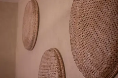 a wall with two pieces of metal on it at Riad Amara Private pool breakfast in Marrakech