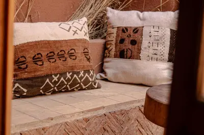 a group of pillows sitting on top of a table at Riad Amara Private pool breakfast in Marrakech