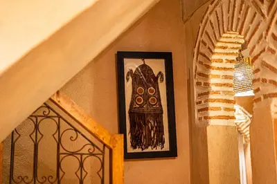 a picture on a wall next to a stairway at Riad Amara Private pool breakfast in Marrakech
