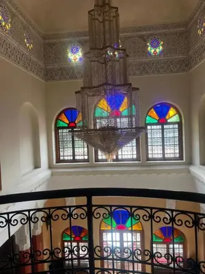 a room with a chandelier and stained glass windows at Villa Oum Palace in Marrakech