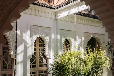 a white entrance to a house with plants at Riad Ever - Entièrement privatisé in Marrakech