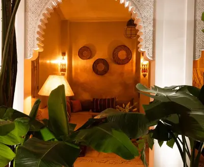 a living room with a couch and a mirror at Riad Ever - Entièrement privatisé in Marrakech