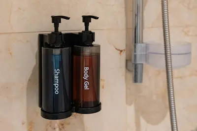 two oxygen bottles hanging on a wall in a bathroom at Appartement de luxe au Plaza, au coeur de Marrakech in Marrakech