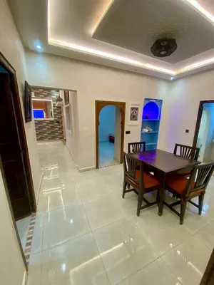 a dining room with a table and chairs at Villa d'Exception avec Piscine Privée in Marrakech