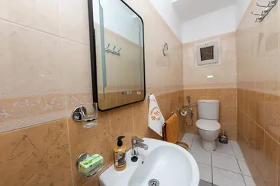 a bathroom with a sink and a toilet at Riad Marrakech Golden Star 82 with 3 Rooms & Pool in Marrakech