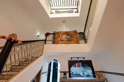 a staircase with a mirror and a skylight at Riad Marrakech Golden Star 82 with 3 Rooms & Pool in Marrakech