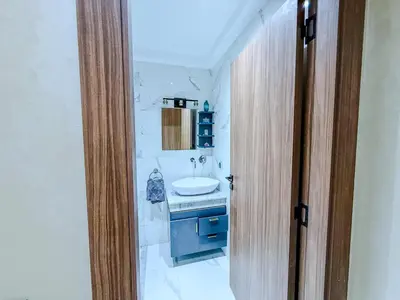 a bathroom with a sink and a mirror at Modern Studio Menara Garden in Marrakech