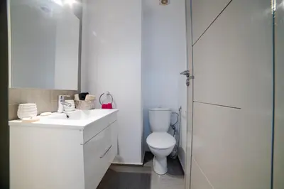 a bathroom with a toilet and a sink and a shower at Appartemment top Marrakech in Marrakech