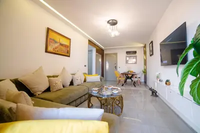 a living room with a couch and a table at Appartemment top Marrakech in Marrakech