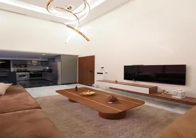 a living room with a couch and a coffee table at Écrin Cosy au Cœur de Guéliz Emplacement Central in Marrakech