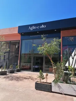 ainia ceolis storefront with plants in front of a building at Noria Golf Marrakech Pool in Marrakech