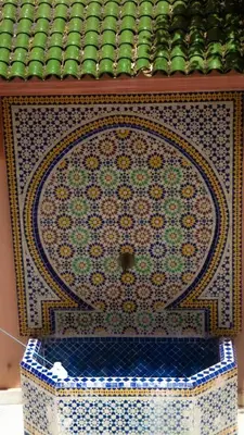 a dresser with a tiled top in a room at Welcome to Riad Glam Marrakech in Marrakech