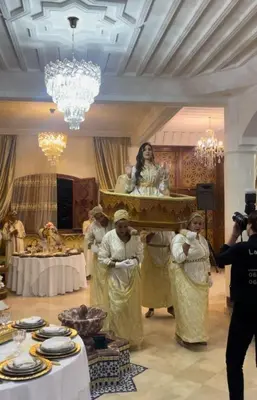 a group of people standing in a room with a woman at Welcome to Riad Glam Marrakech in Marrakech