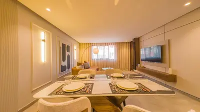 a dining room with a long table and chairs at MOZAIC26 I Terrasse & Piscine couverte I Hivernage in Marrakech