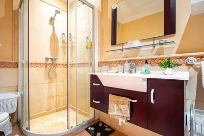a bathroom with a sink and a shower at Appartement de charme avec piscine a Marrakech in Marrakech
