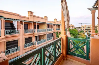 a balcony with a view of the city at Appartement de charme avec piscine a Marrakech in Marrakech