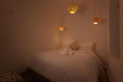 a bedroom with a bed with two stuffed animals on it at Riad Abrare-A in Marrakech