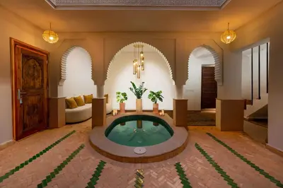 a living room with a tub in the middle of a room at Riad Abrare-A in Marrakech