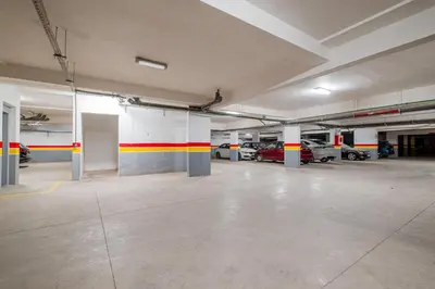 an empty parking garage with cars parked in it at 1BR Cosy 2 min M Avenue Parking, Piscine & Fibre in Marrakech