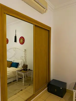 a room with a glass door leading to a bed at Cozy appartment - private terrace - Gueliz in Marrakech