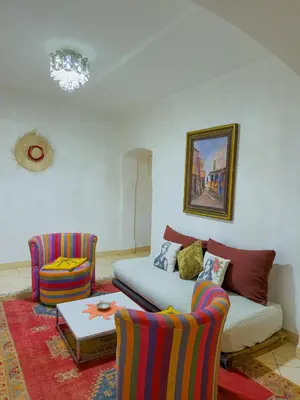 a living room with a couch and two chairs at Cozy appartment - private terrace - Gueliz in Marrakech