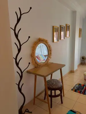 a dressing table with a mirror and a stool at Cozy appartment - private terrace - Gueliz in Marrakech