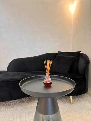 a table in a living room with a couch at Verona Studio - 1 Bedroom Piscine & Rooftop in Marrakech