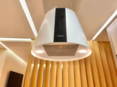 a light hanging from a ceiling with a speaker at Verona Studio - 1 Bedroom Piscine & Rooftop in Marrakech