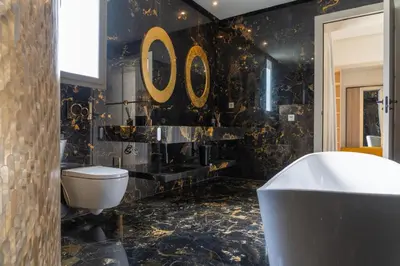 a bathroom with a toilet and a sink and a tub at THE ESTATE - Marrakech in Marrakech
