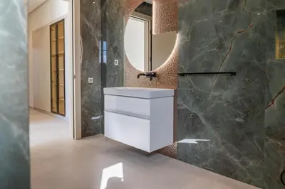 a bathroom with a white sink and a mirror at THE ESTATE - Marrakech in Marrakech