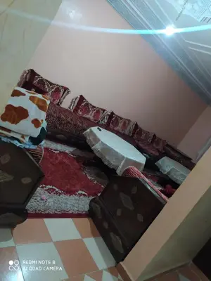 a room with a bunch of pillows on the floor at Appartement meublé calme près de l'aéroport menara in Marrakech