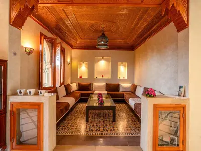 a living room with a couch and a table at Hôtel Boutique RAM SPA in Marrakech