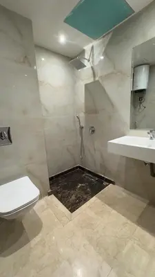 a bathroom with a shower and a sink and a toilet at Stylish 1-Bed Retreat in Marrakech