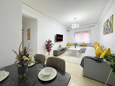 a living room with a couch and a table at L'Havre de Paix 2 in Marrakech
