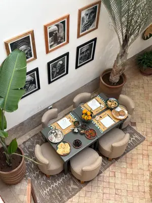 an overhead view of a table and chairs with food on it at Riad melqa piscine privée - Medina Marrakech in Marrakech