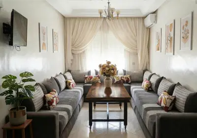 a living room with couches and a coffee table at Appart de luxe 3 in Marrakech