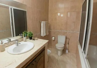 a bathroom with a sink and a toilet at Appart de luxe 3 in Marrakech