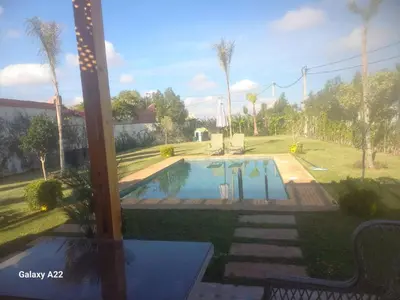 a view of a swimming pool in a yard at Villa Marrackech in Marrakech