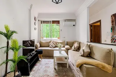 a living room with a couch and a table at Spacious Can 2025 Iptv Guéliz 7 min away in Marrakech