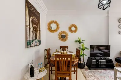 a dining room with a table and chairs at Spacious Can 2025 Iptv Guéliz 7 min away in Marrakech