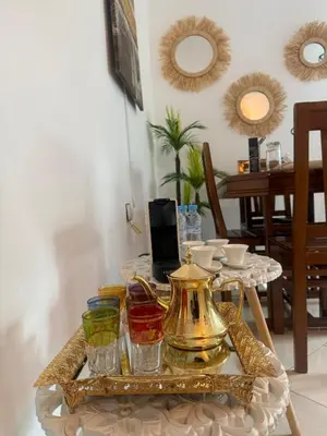 a table with a tea kettle and glasses on it at Spacious Can 2025 Iptv Guéliz 7 min away in Marrakech