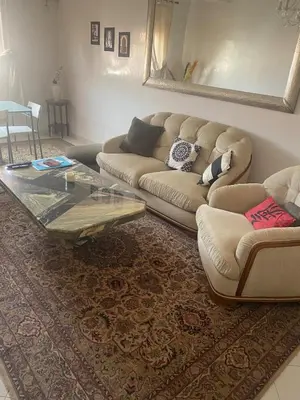 a living room with a couch and a coffee table at Appartement hivernage in Marrakech