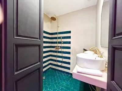 a bathroom with a sink and a shower at Maison Meurisse KHAMSaPrivate pool and breakfast in Marrakech