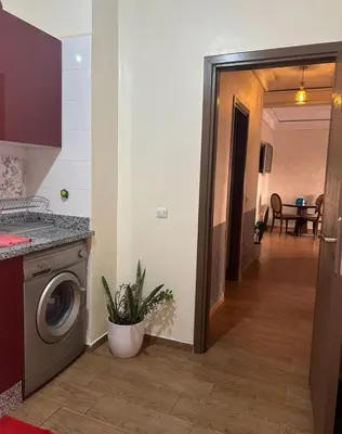 a kitchen with a washing machine in a room at Appt á louer TF2 in Marrakech