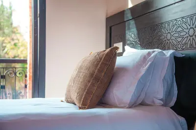 a pillow sitting on top of a bed at Villa Aylal in Marrakech