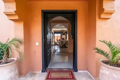 an entrance to a house with an open door at Villa Aylal in Marrakech