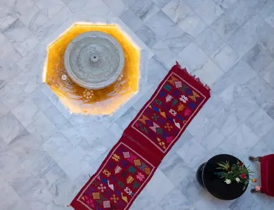 an overhead view of a table with a bowl and a plate at Riad Dreams Med in Marrakech