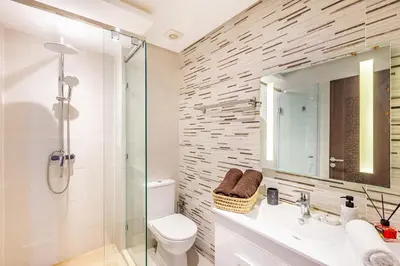 a bathroom with a shower and a toilet and a sink at Résidence jnan ali 4 Marrakech in Marrakech